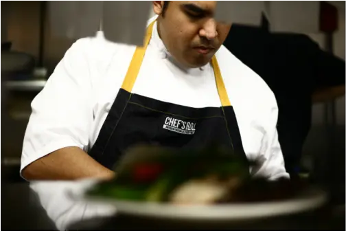 Chef Tai working in the kitchen.