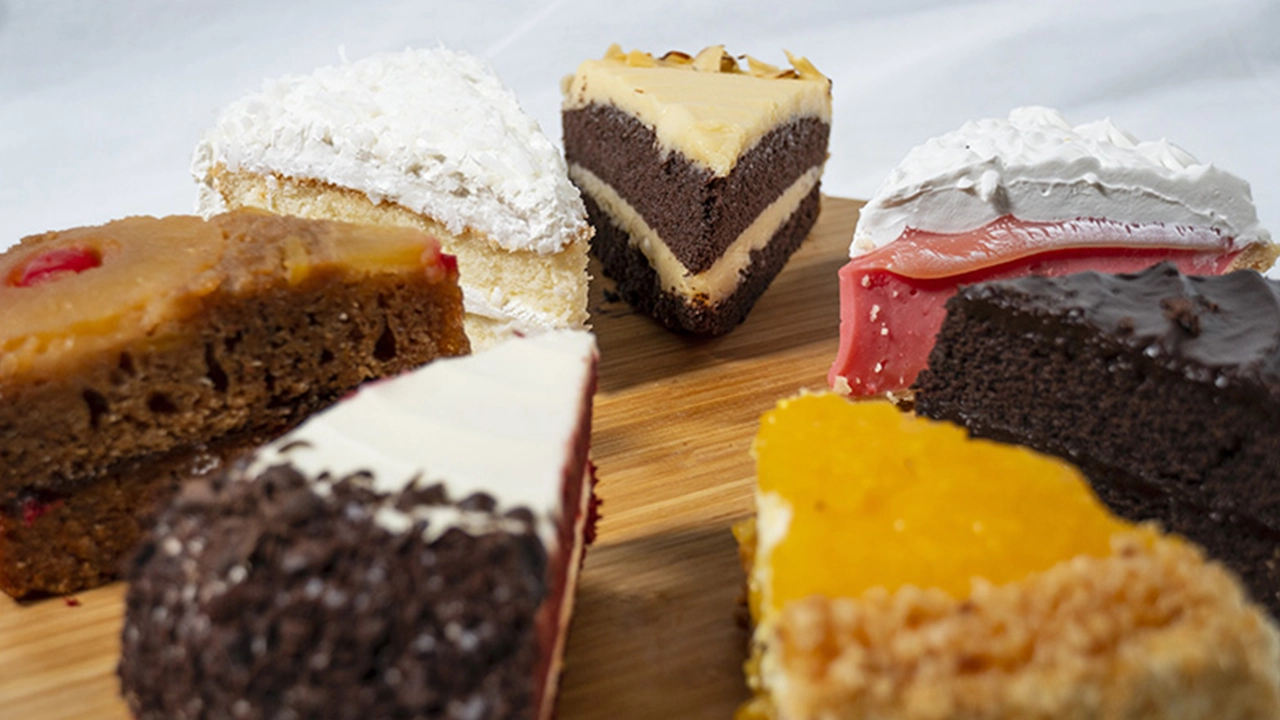 Six different selections of Ted's Bakery cake sliced and arranged in a circle.