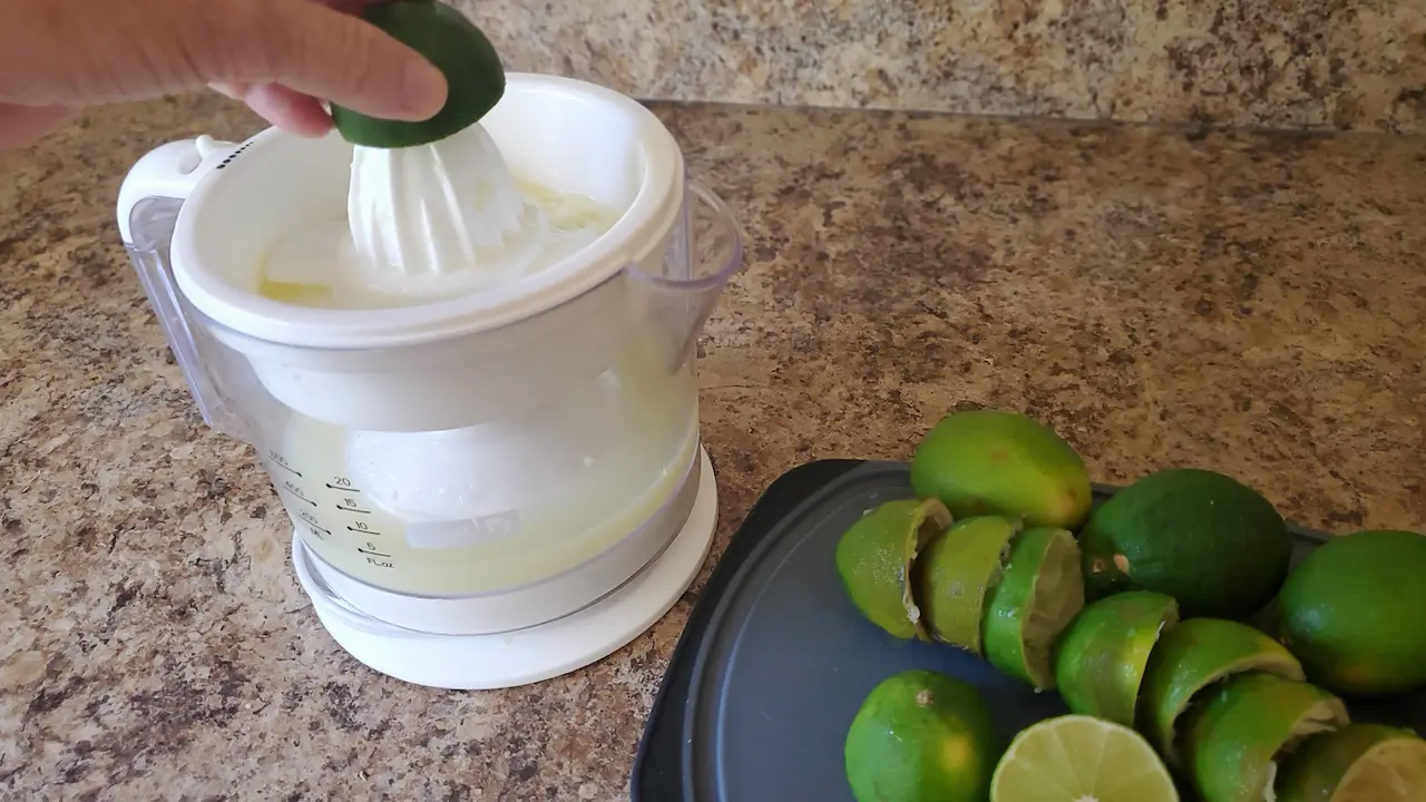 Using an electric juicer.