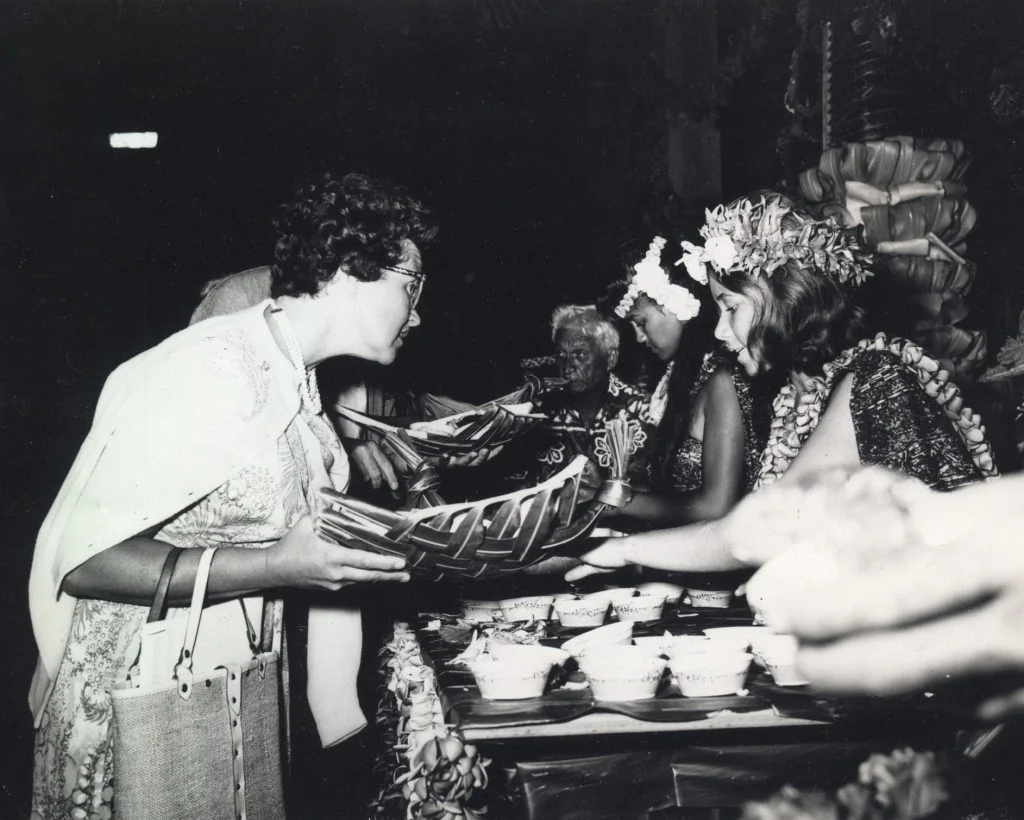 Ladies serving food at a lūʻau.
