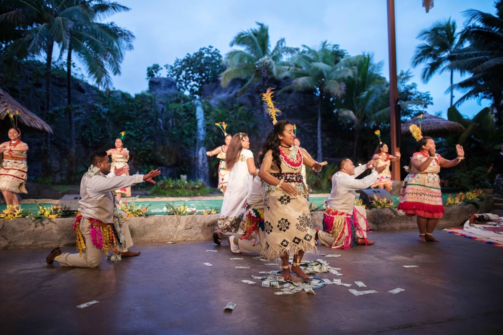 Tongan couple doing traditional Tongan dance during wedding ceremony