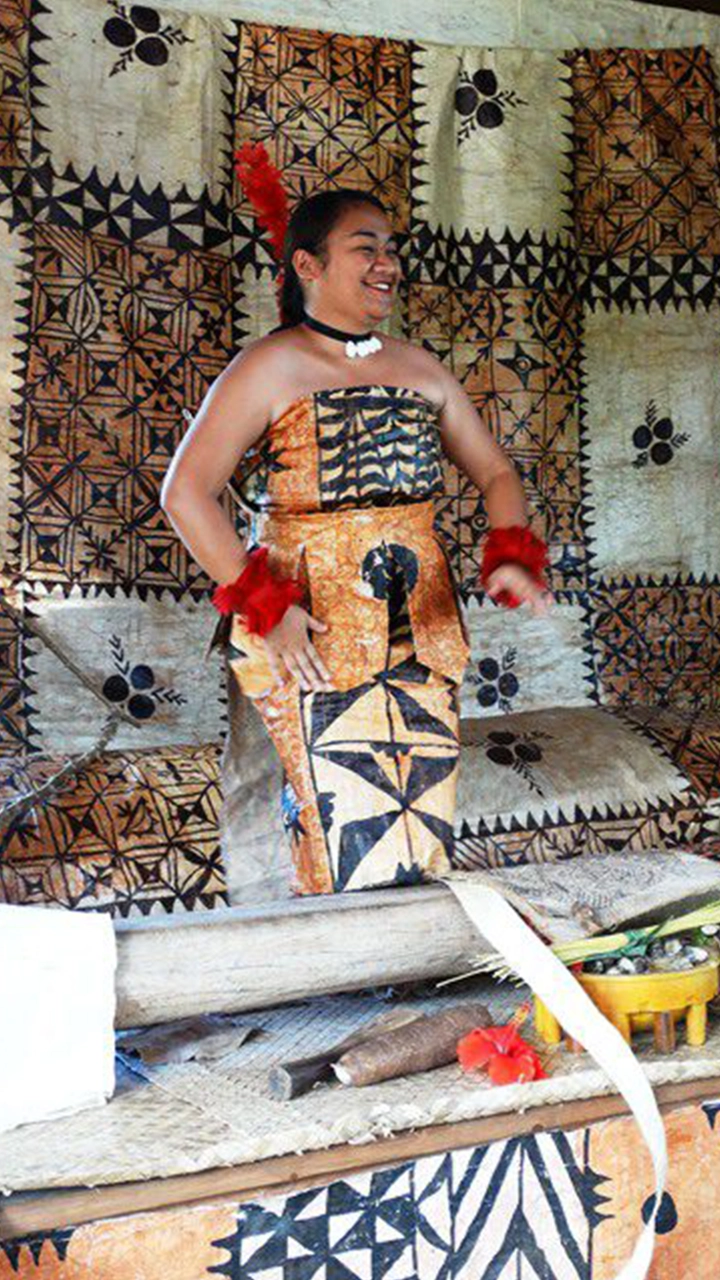 Tongan lady showcasing traditional tapa cloth