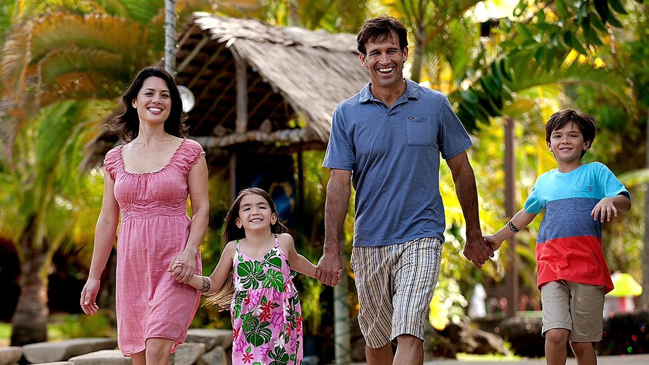 A family enjoying their time together at the Polynesian Cultural Center.