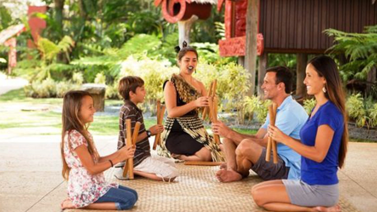 Family learning a cultural game together.