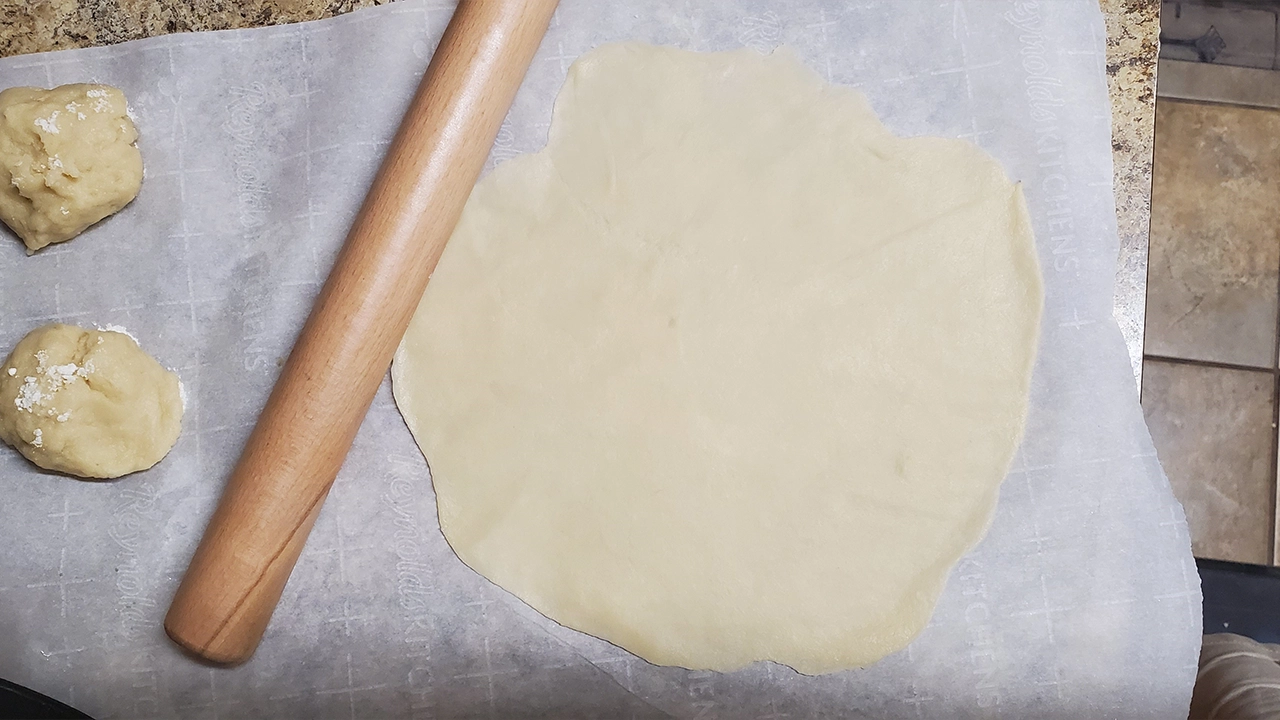 Dough pressed very thin using a rolling pin.