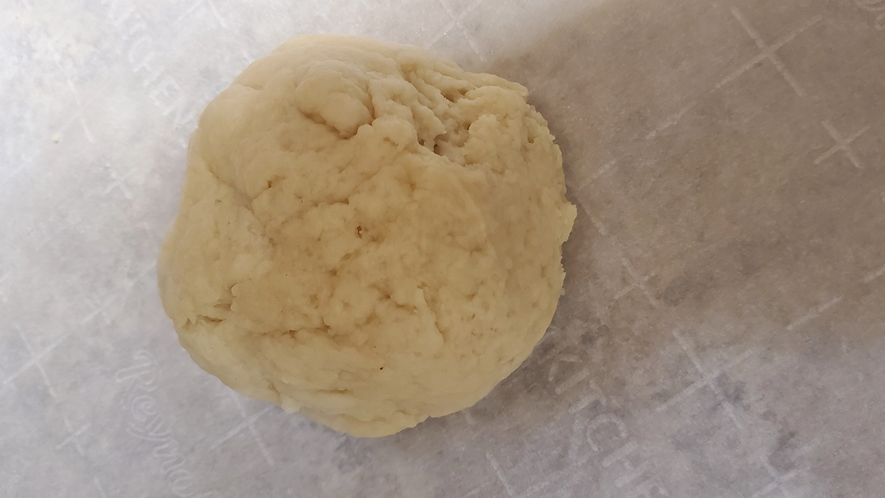 Ball of simple dough ready to form into flat rounds