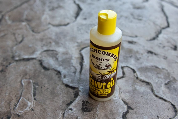 Bottle of coconut oil sun care.