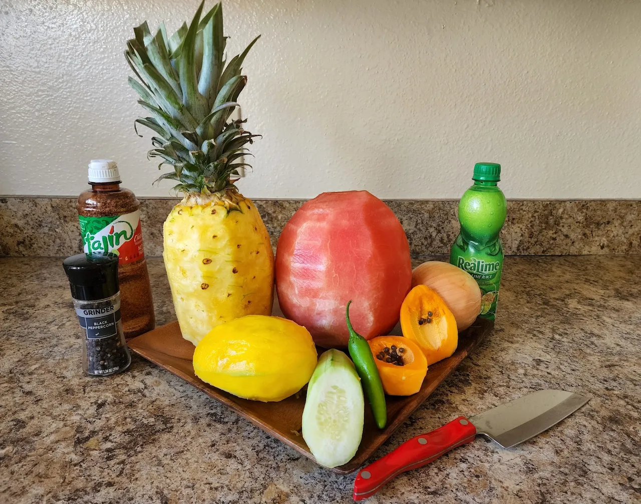 Numerous fresh fruits peeled and ready to chop for the fresh tropical fruit salsa recipe