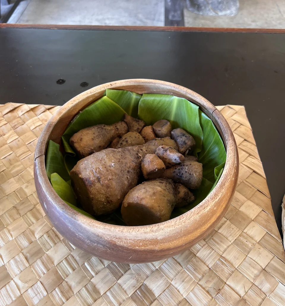 Kalo corms collected in a bowl.